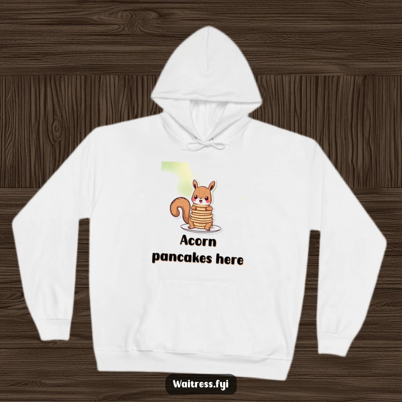 Funny squirrel pancakes hoodie showing a cartoon squirrel peeking over a massive stack of pancakes, looking slightly overwhelmed but happy.